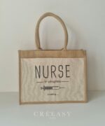 Sac shopping en toile de jute avec poche avant en coton Nurse in progress